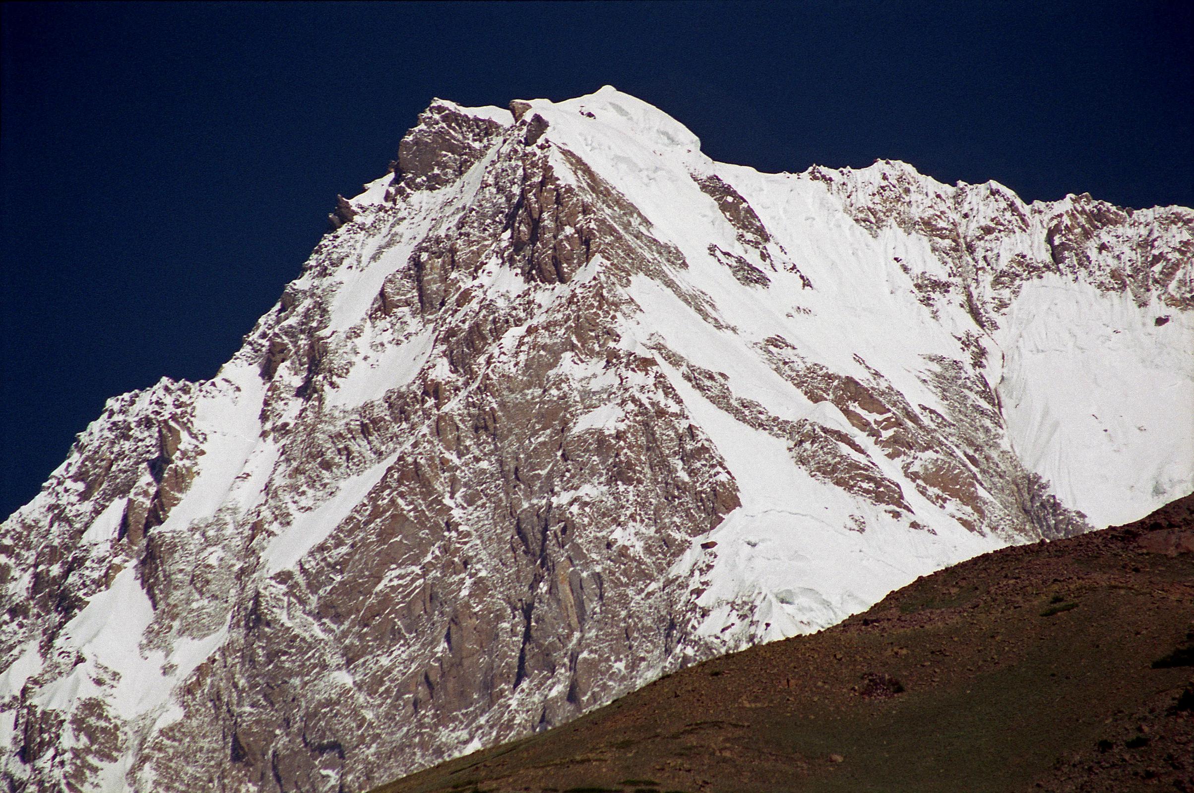 13 Nanga Parbat Close Up On Trek From Tarashing To Rupal Face Base Camp The trek from Tarashing climbs over the Tarashing Glacier with a view of the Rupal Village ahead. After passing the lush fields of Rupal Village, an excellent view of Nanga Parbat comes into view, with the Rupal Face to the left, the summit, and the East Face to the right.